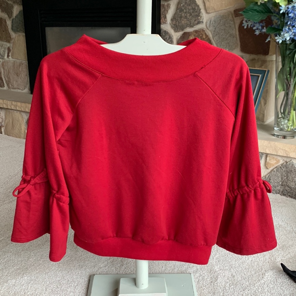 Alya maroon in color 3/4 length sleeve top.
